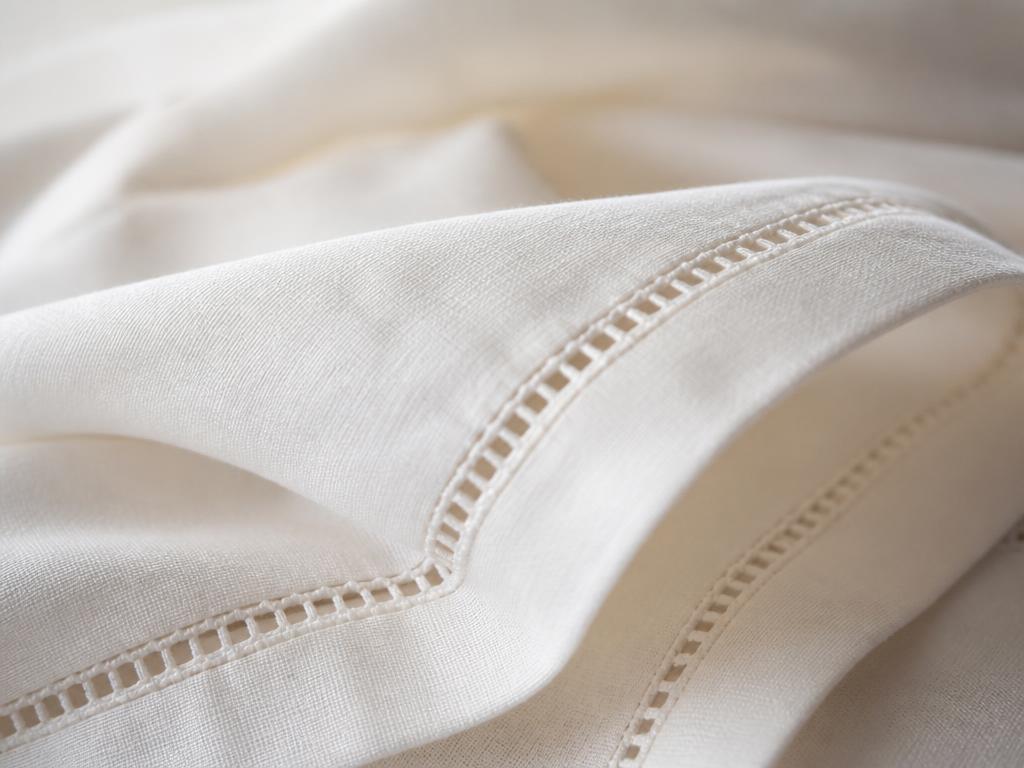 Close view of a long-staple cotton shell with hemstitched finishing